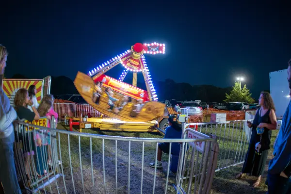 Pirate's Revenge ride swinging at night at the Ag Fair