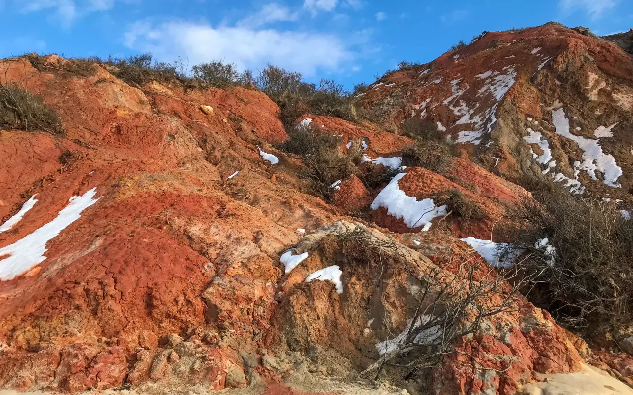 Red clay strata at Aquinnah under winter snow