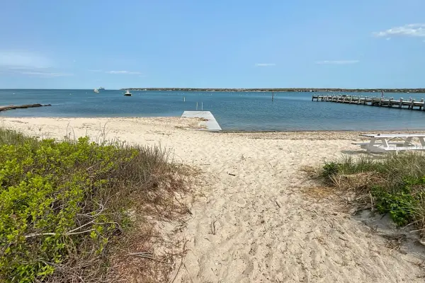 The sandy path to the harbor beach
