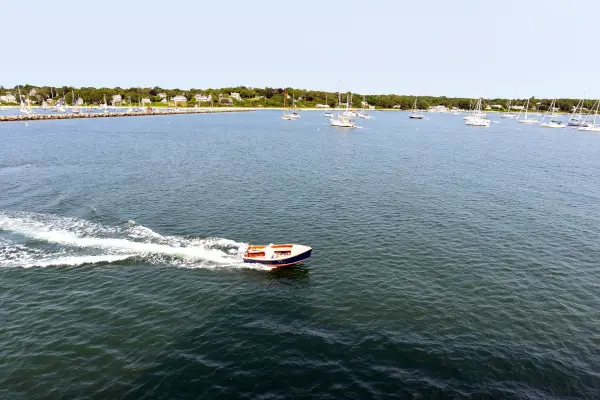 Motorboat leaving a wake across Vineyard Haven harbor