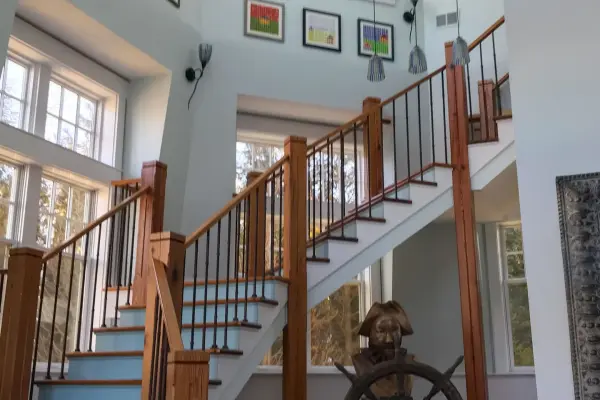 Staircase and ship's wheel inside an Edgartown captain's house