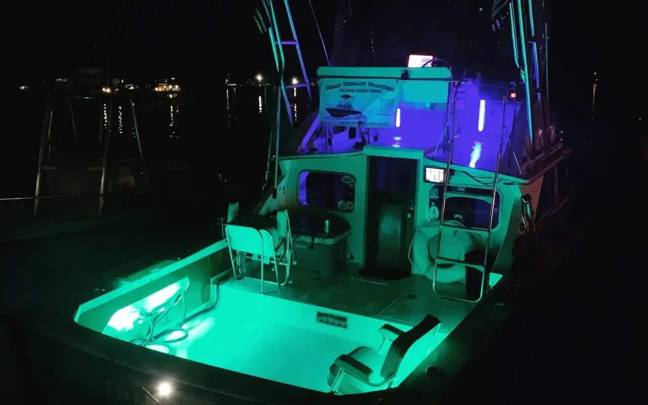 The Cheap Therapy charter boat at night on Martha’s Vineyard