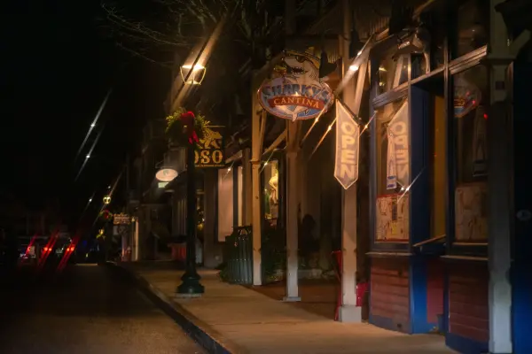Sharkys Cantina sign on a quiet Circuit Avenue night