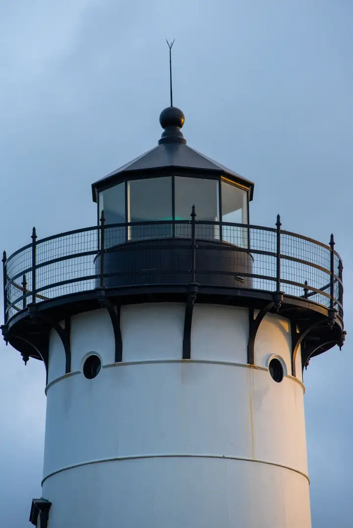 The lantern room of the East Chop Lighthouse at dusk in Oak Bluffs