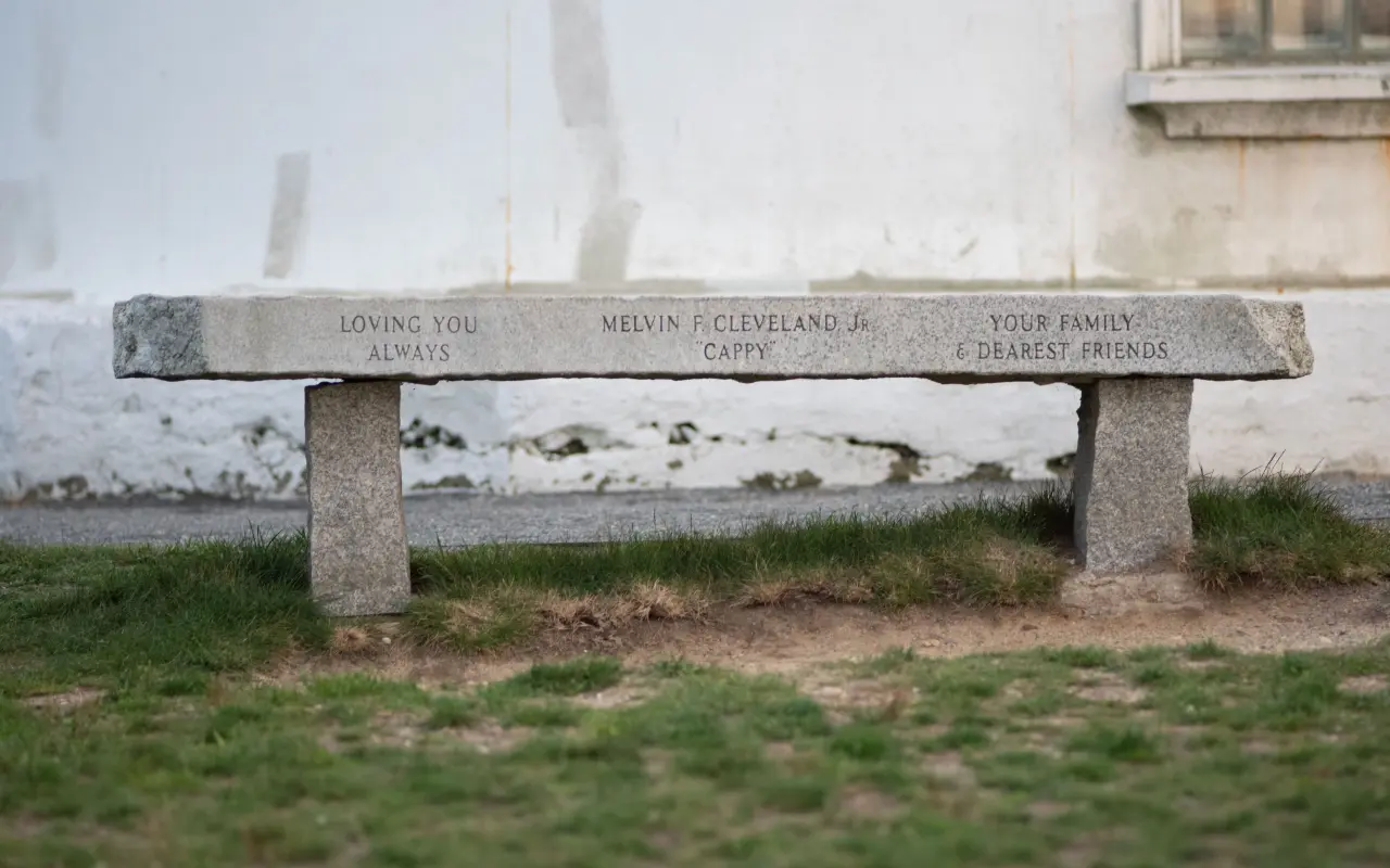 Granite memorial bench on the lawn beside the East Chop Lighthouse in Oak Bluffs