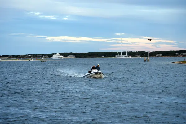 Small boat motoring across Edgartown Harbor
