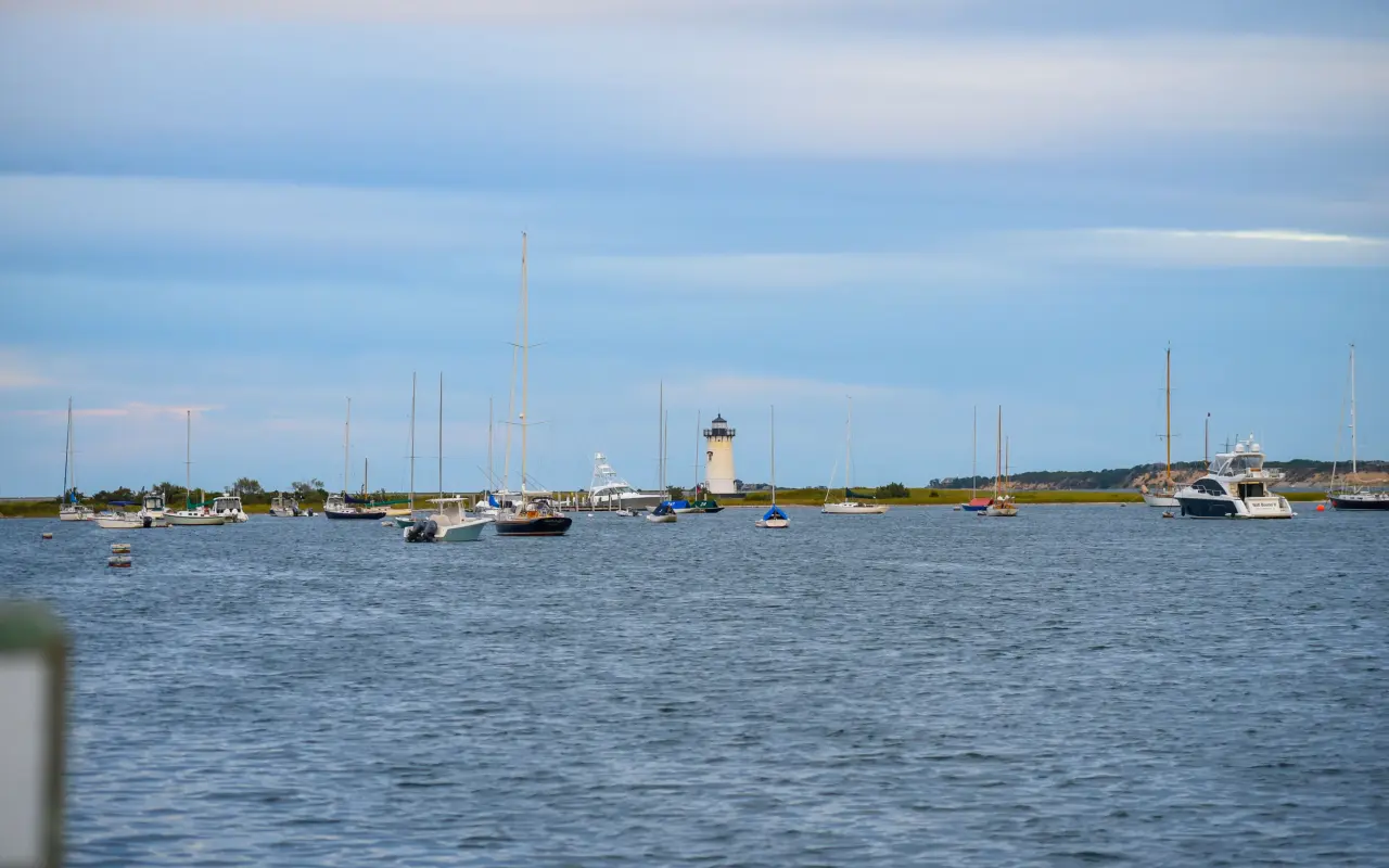 Boats sailing around Edgartown Lighthouse on a summer afternoon