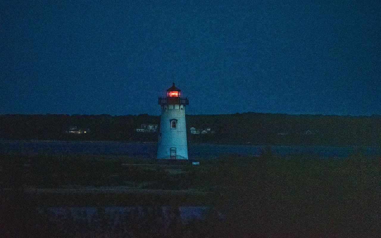 Edgartown Harbor Light at night with its red light showing