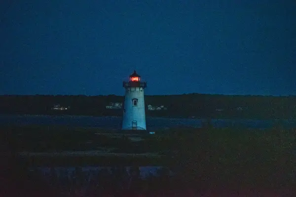 Edgartown Lighthouse glowing red after dark