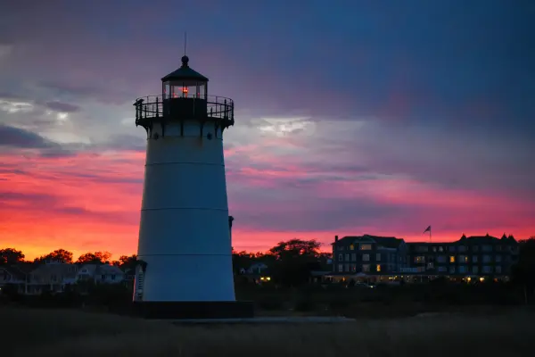 The Edgartown Light against a violet sunset sky.
