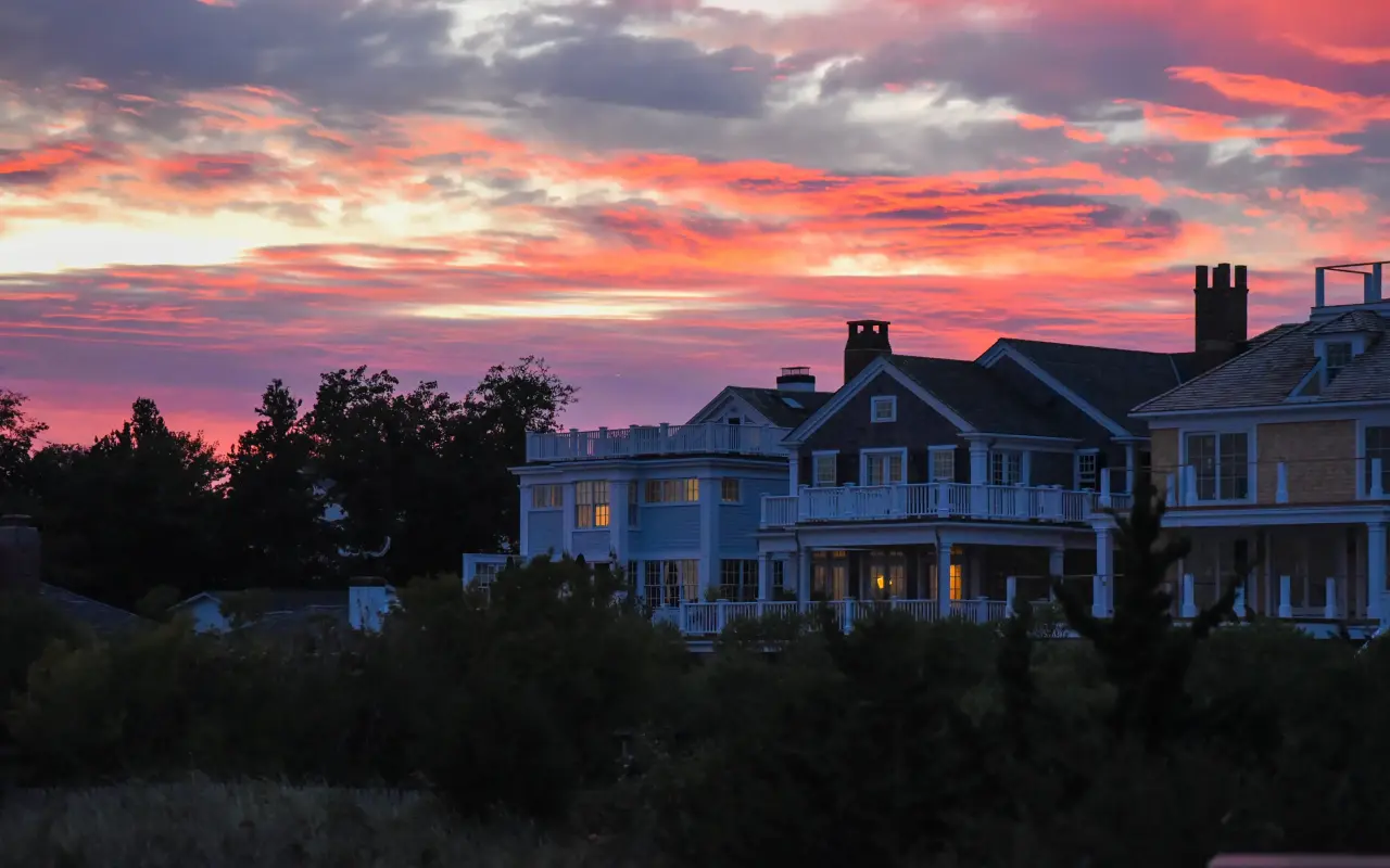 Pink sunset sky over white captains houses in Edgartown