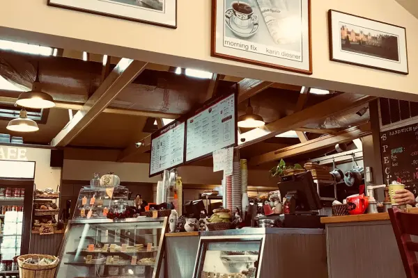 Pastry case and counter inside Espresso Love cafe