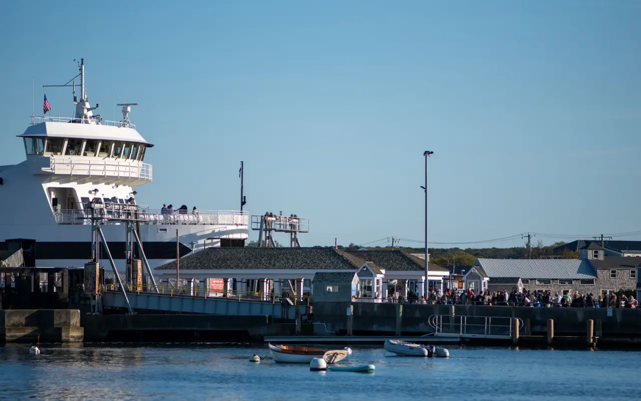 Steamship Authority ferry docked at the Vineyard Haven terminal with passengers on the pier