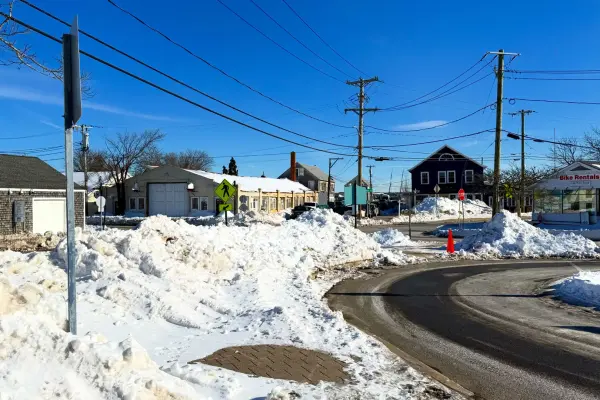Plowed snow piles at Five Corners after a January storm
