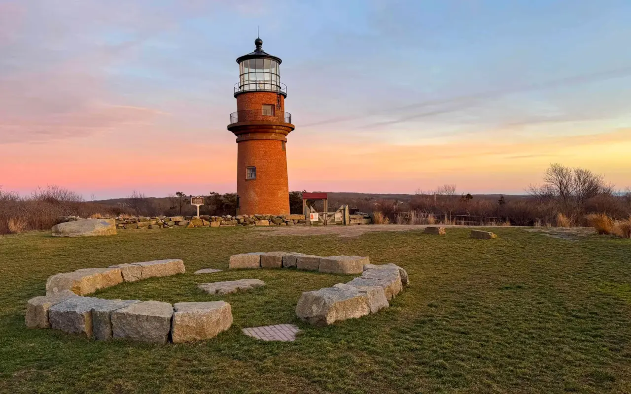 Gay Head Lighthouse at sunset above the Aquinnah cliffs