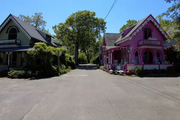 Bright pink gingerbread cottage along a Campground lane
