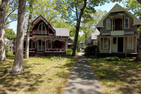 Gingerbread cottages along a shaded Campground path
