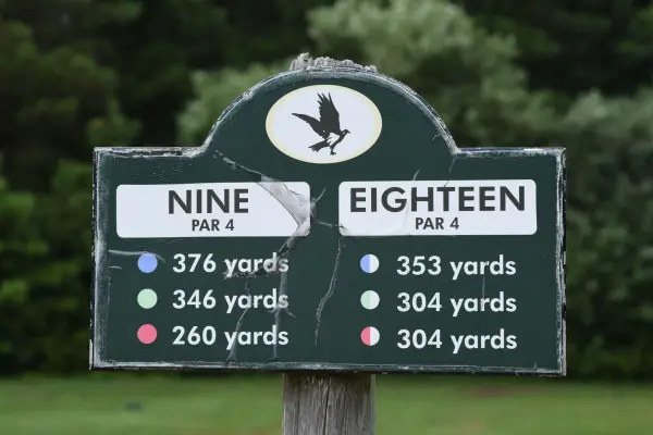 Weathered tee marker for holes nine and eighteen