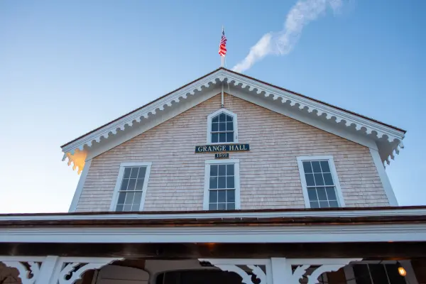 Grange Hall gable with its 1859 sign and American flag