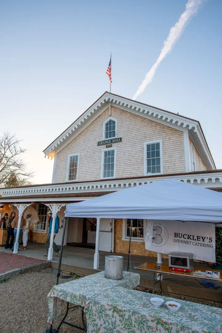The 1859 Grange Hall in West Tisbury with a market tent set up outside