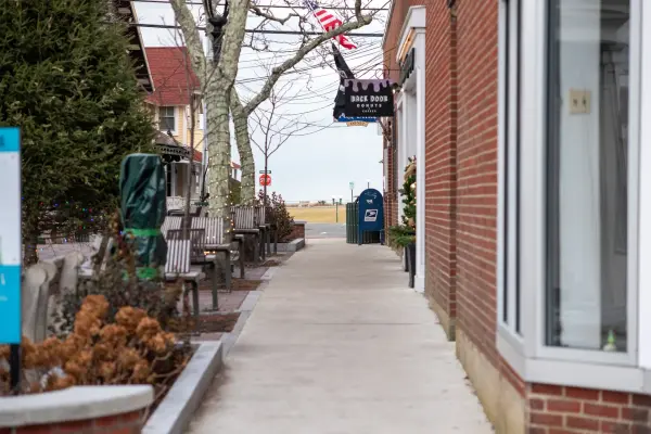 Winter sidewalk near Healey Square with Back Door Donuts sign