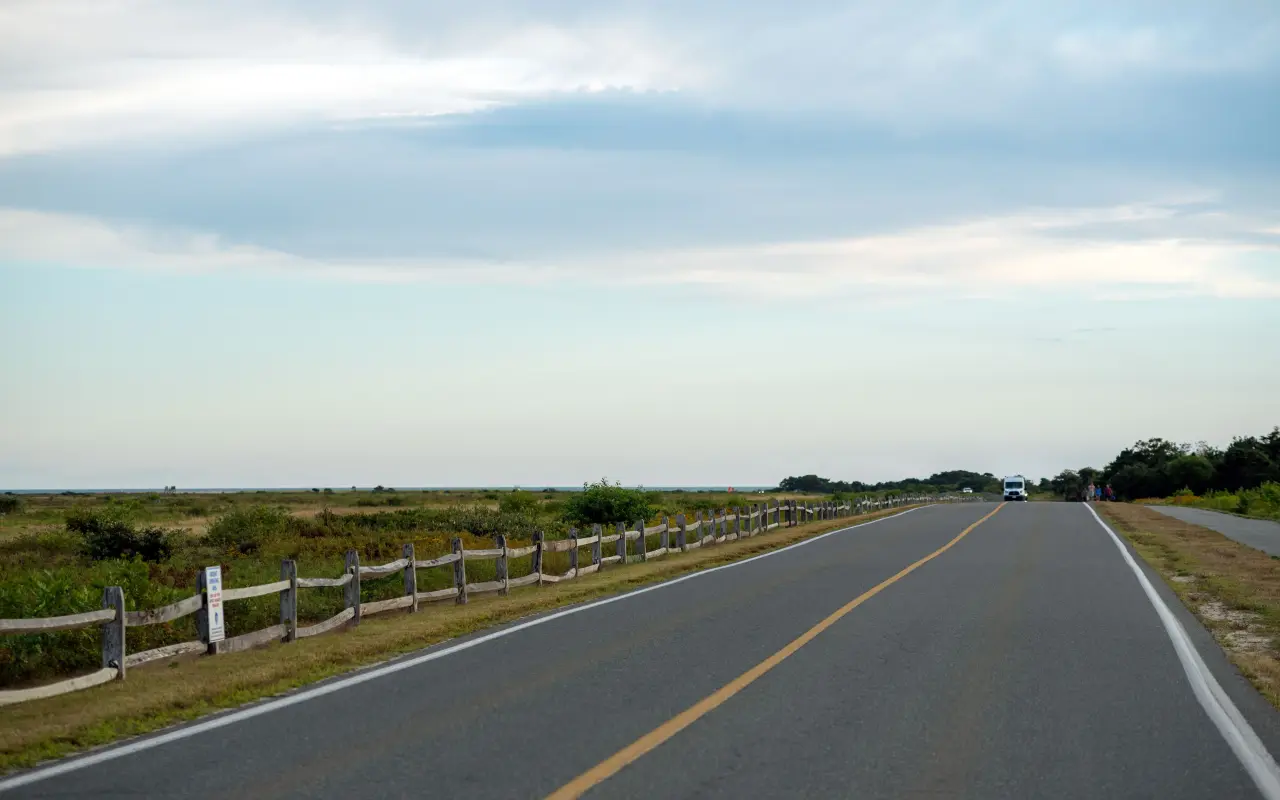 The road across the Katama plains with a split-rail fence