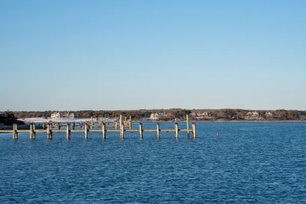 Empty pilings and docks on Katama Bay in winter