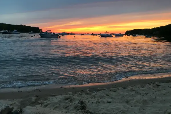 An orange sunset on the Tashmoo shore
