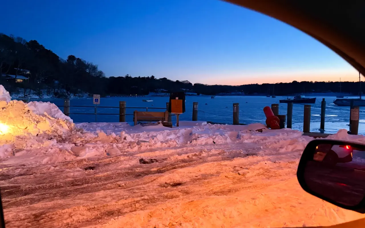 Snow at the Lake Tashmoo landing with boats on the water in winter 2026