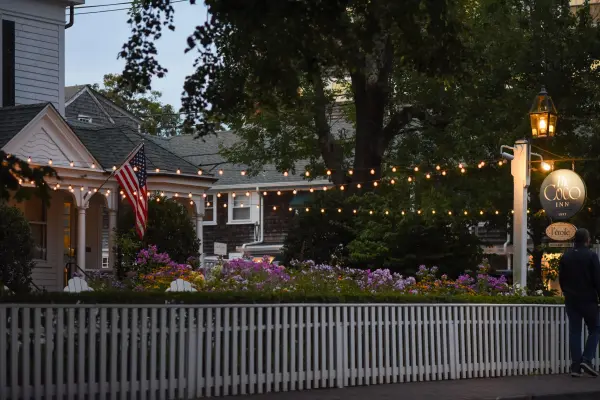Dusk and string lights at L'Etoile's corner of Edgartown.