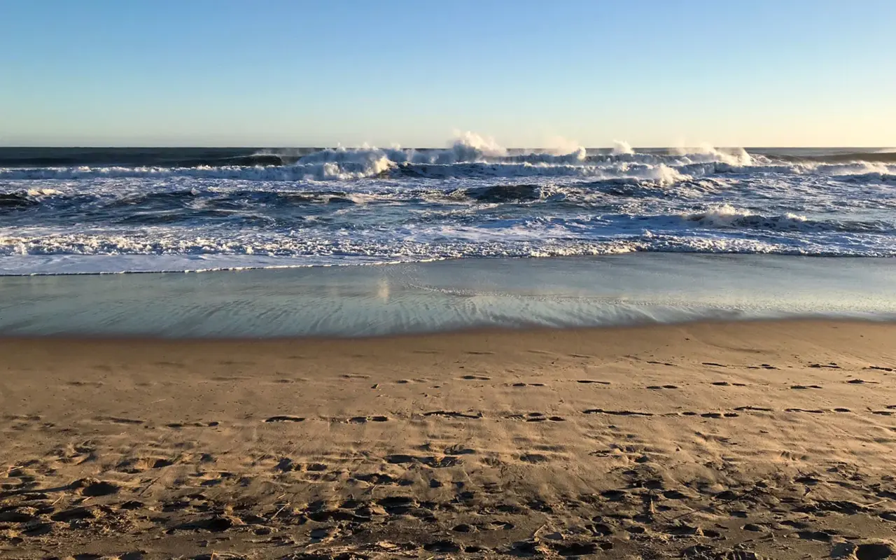 Waves breaking on the sand at Lucy Vincent Beach