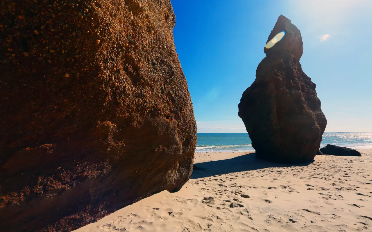 Two eroded sea stacks on the sand at Lucy Vincent Beach