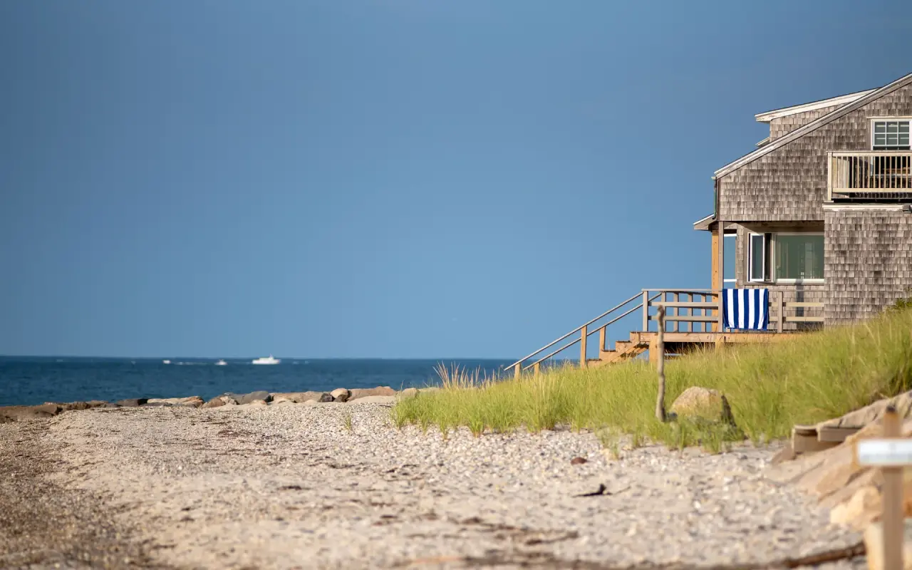 Shingled house on a bluff above a beach on Martha’s Vineyard