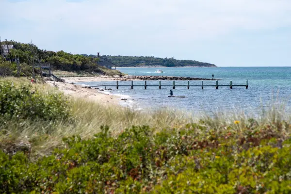 Shoreline and small jetty pier on a Vineyard Haven beach day