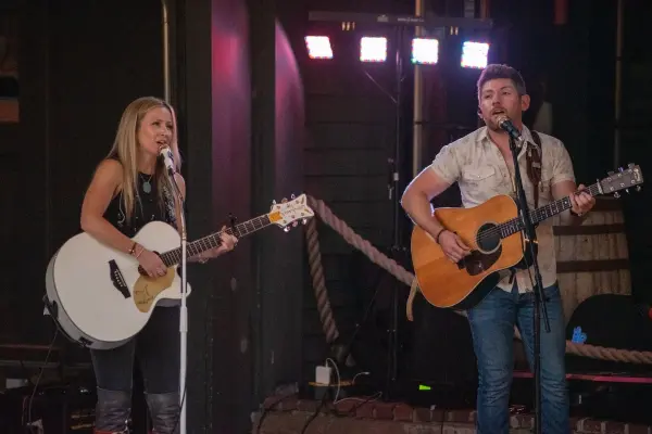Country duo Martin and Kelly performing live with acoustic guitars