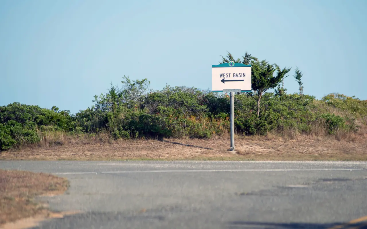Road sign pointing to West Basin on the way into Menemsha