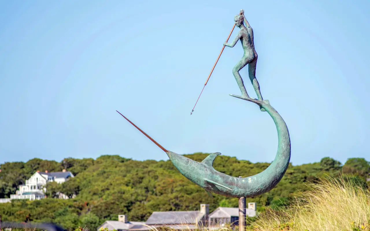 Harpooner sculpture against the sky at Menemsha