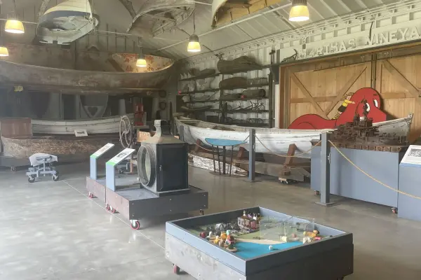 Historic whaleboats and catboats inside the Martha's Vineyard Museum
