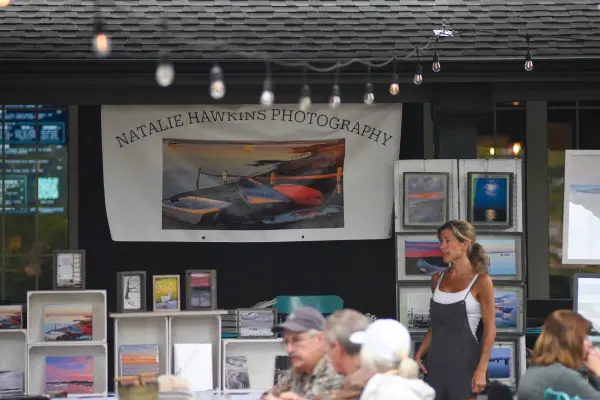 Natalie Hawkins Photography banner above a display of framed prints