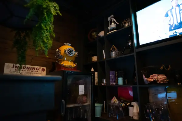 Vintage diving helmet and nautical decor inside Nomans