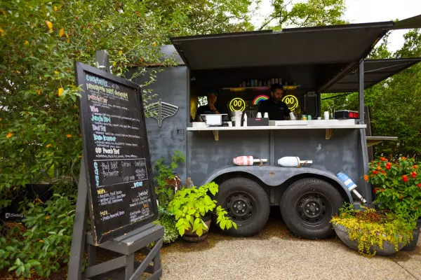 Cocktail trailer with chalkboard drink menu at Nomans