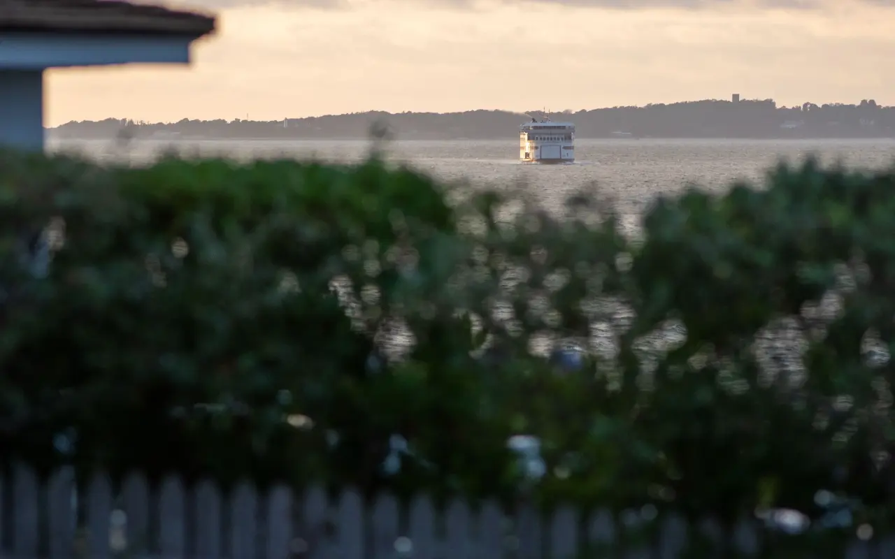 Ferry approaching Oak Bluffs with view toward East Chop Lighthouse