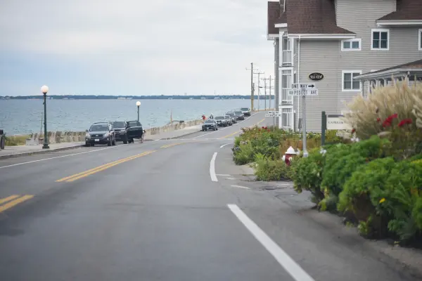 Waterfront street with parked cars near Pequot Avenue