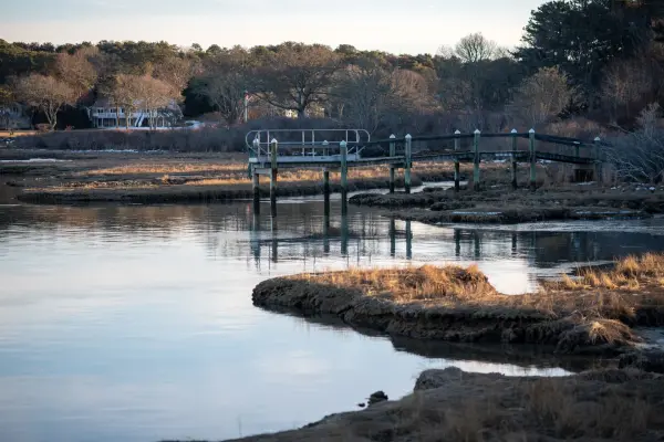 Footbridge over the salt marsh in low winter light, Oak Bluffs