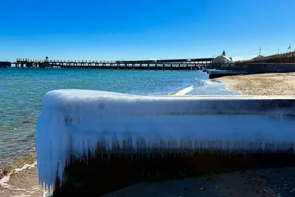 Ice-crusted seawall with icicles near the Oak Bluffs pier