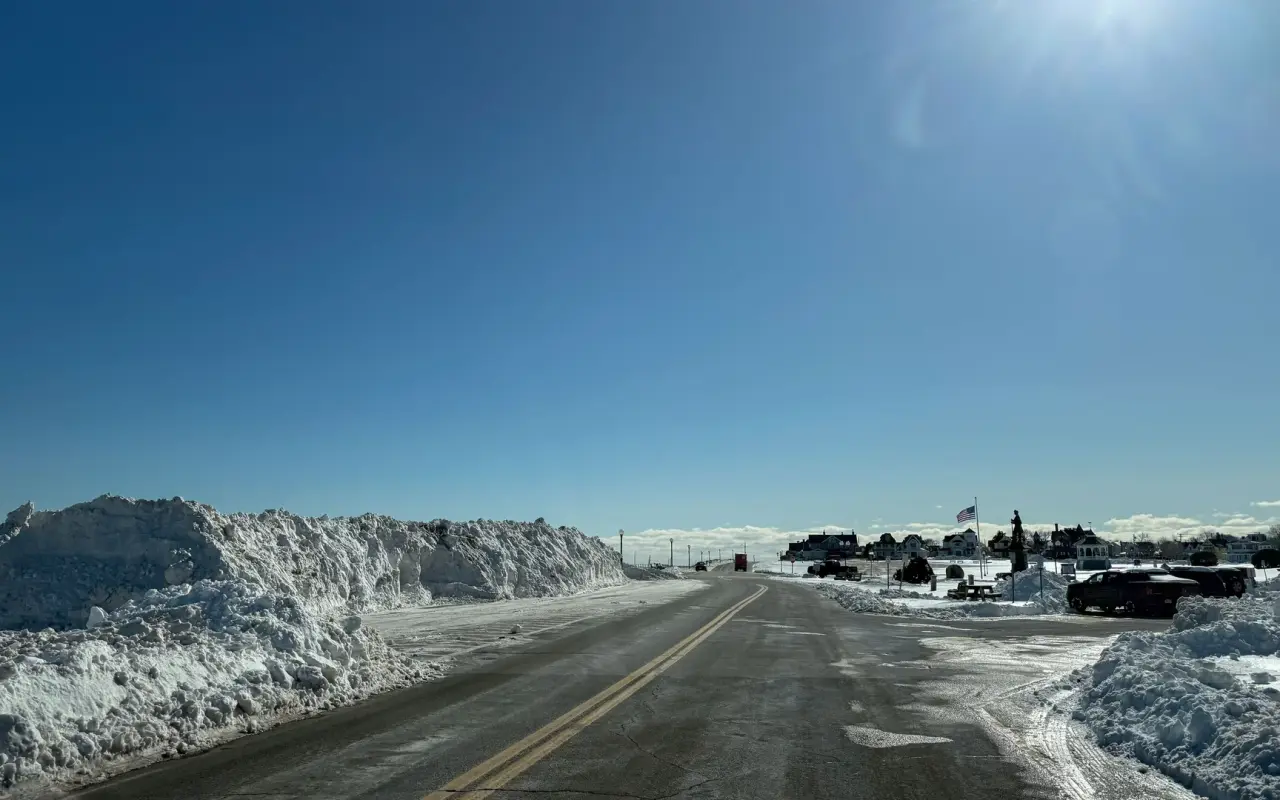 Snow banks along a sunny road in Oak Bluffs