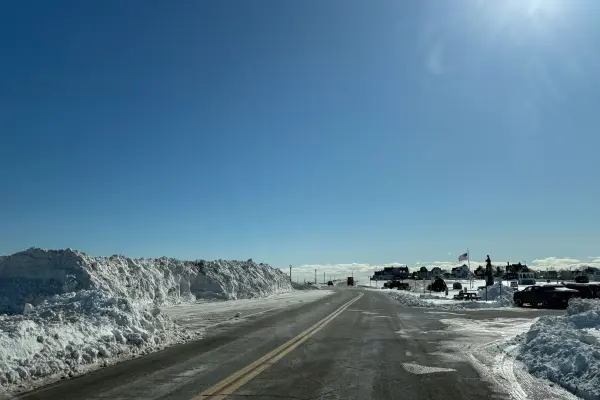Tall snowbanks along a shore road in Oak Bluffs