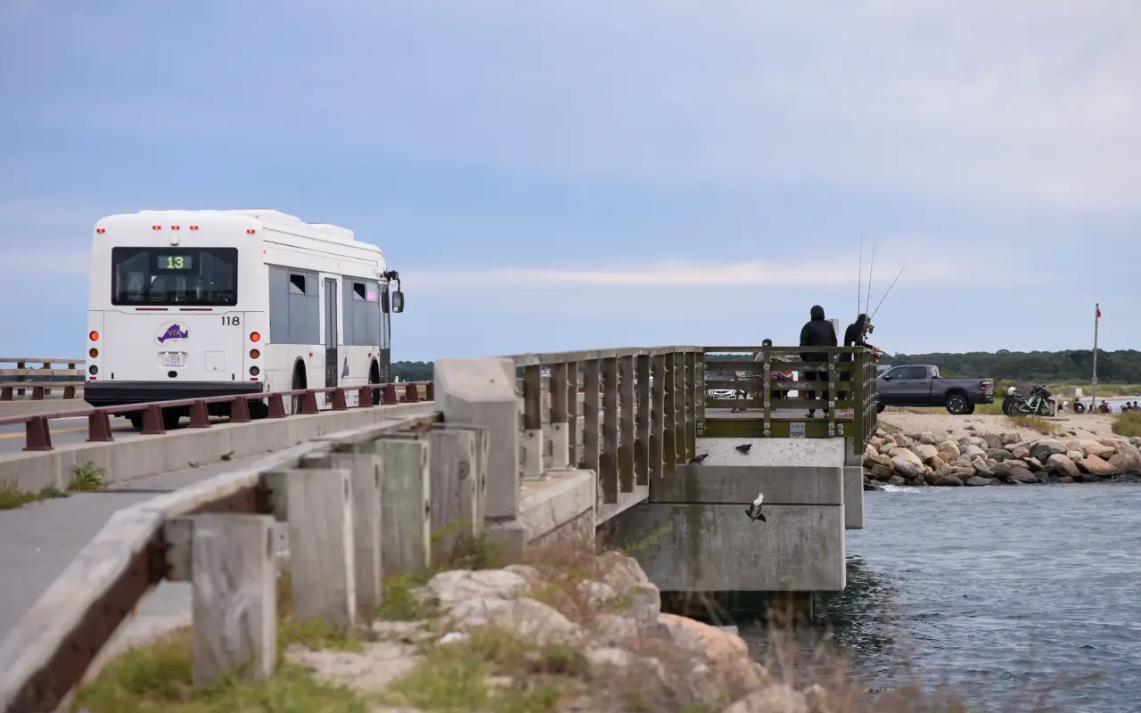 Anglers fishing from the pier at the Jaws Bridge on State Beach as a VTA bus passes