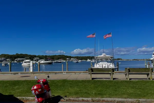 Red moped parked along Oak Bluffs Harbor