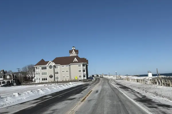 Cupola-topped building along a snowy Oak Bluffs shore road